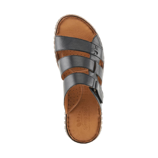 Black and tan closed-toe leather sandal with wide straps and a buckled ankle strap, top view