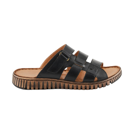 Black leather women’s sandal with wide straps, tan footbed, and ridged brown sole