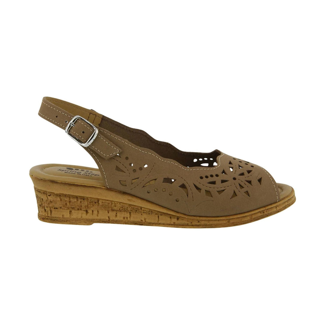 Beige closed-toe wedge sandal with laser-cut floral cutouts and an ankle buckle strap