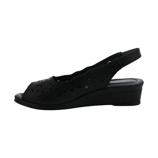 Black open-toe wedge sandal with laser-cut floral side panels and slingback strap