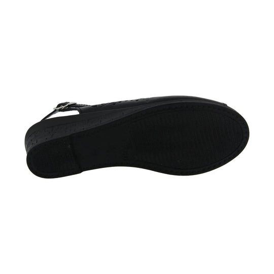 Black sandal sole view with a flat treaded outsole and ankle strap hardware