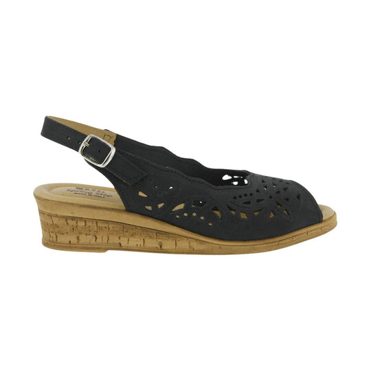 Black closed-toe wedge sandal with laser-cut floral pattern and adjustable ankle strap