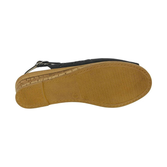 Black strappy sandal shown from the sole side with tan treaded outsole and silver buckle