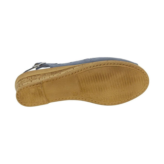 Blue sandal shown from the sole with tan rubber tread and a small heel