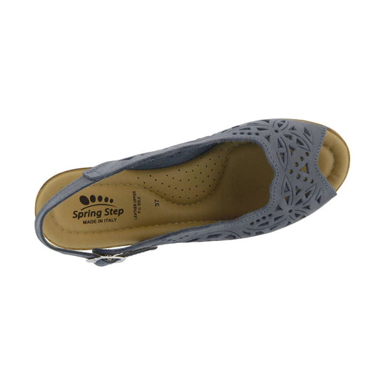 Blue-gray closed-toe slingback sandal with laser-cut floral pattern and tan footbed