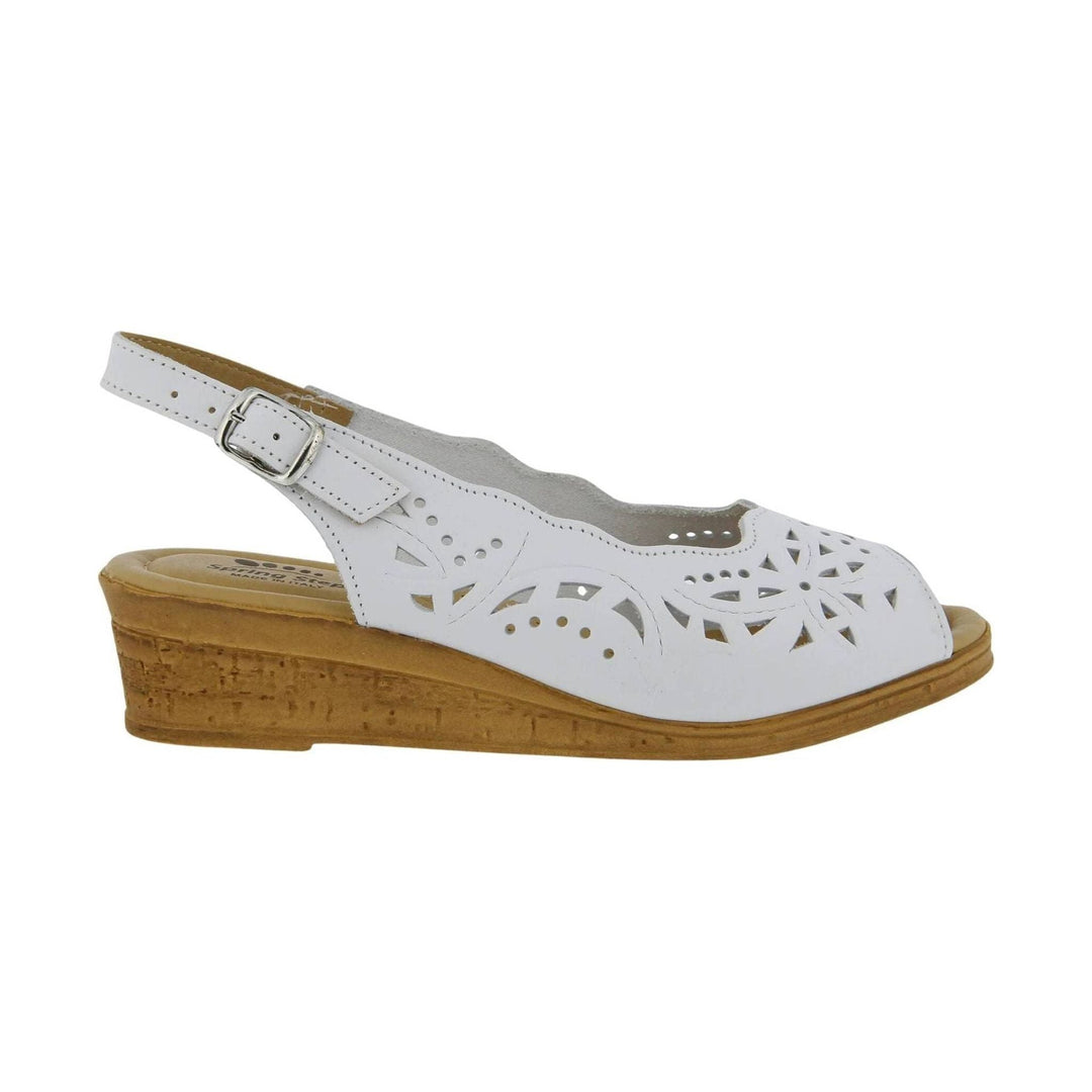 White slingback wedge sandal with floral cutouts and tan cork-style sole