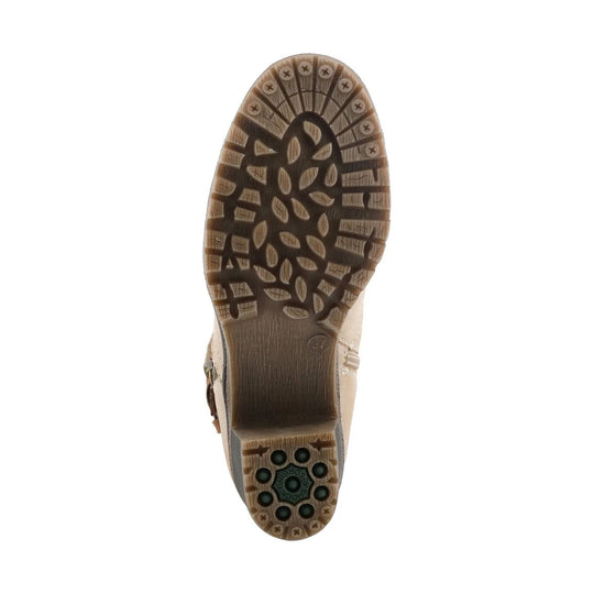Beige boot outsole with brown lug tread and shock-absorbing heel pad