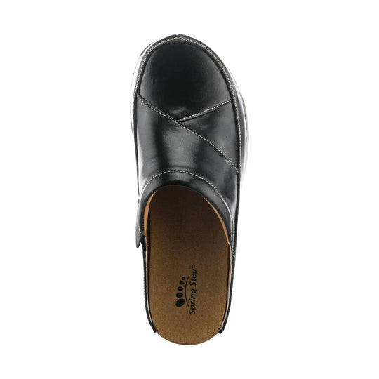 Black closed-toe slip-on clog with stitched overlay and tan footbed, top view