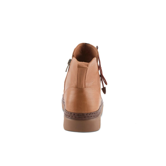 Tan leather ankle boot shown from the back with a thick brown sole and side zipper.