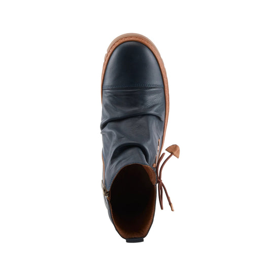 Navy leather ankle boot with tan trim, side zipper, and lace-up back detail