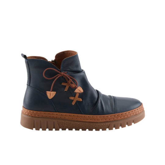 Navy ankle boot with tan sole, brown laces, and a rounded toe