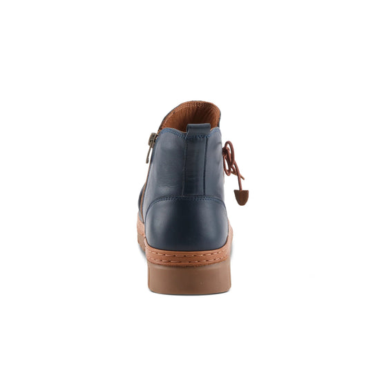 Rear view of navy ankle boot with brown trim, side zipper, and tan sole