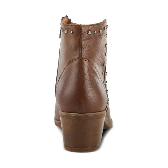 Brown leather ankle boot shown from the back with a chunky stacked heel and silver stud details