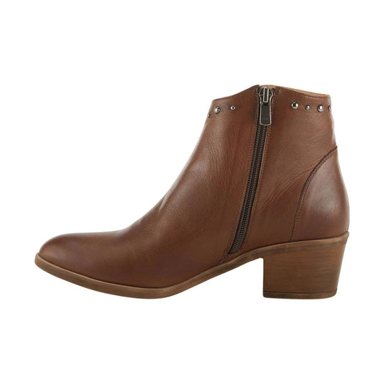 Brown leather ankle boot with side zipper, pointed toe, stacked heel, and stud details