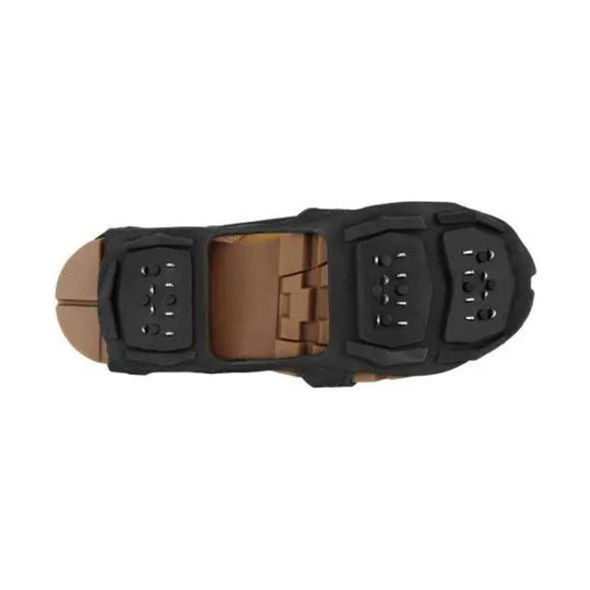 Black and brown boot sole with traction lugs and metal cleats