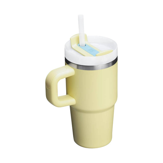 Pale yellow insulated tumbler with handle, white lid, and straw