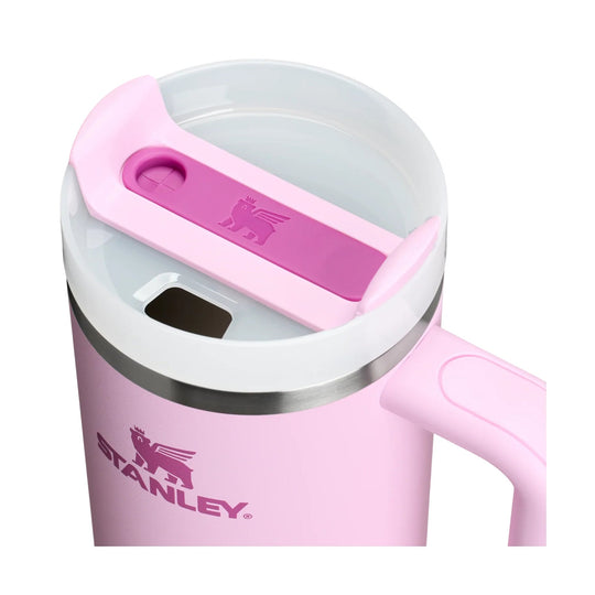 Pink Stanley tumbler lid with clear top, handle, and visible Stanley logo