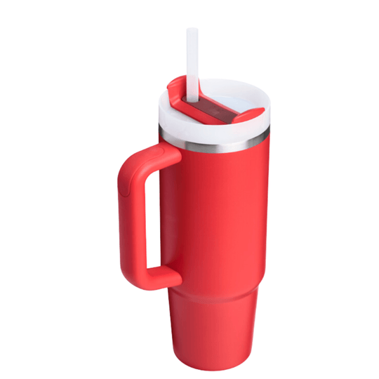 Red handled tumbler with a clear straw and white lid, shown at a slight angle