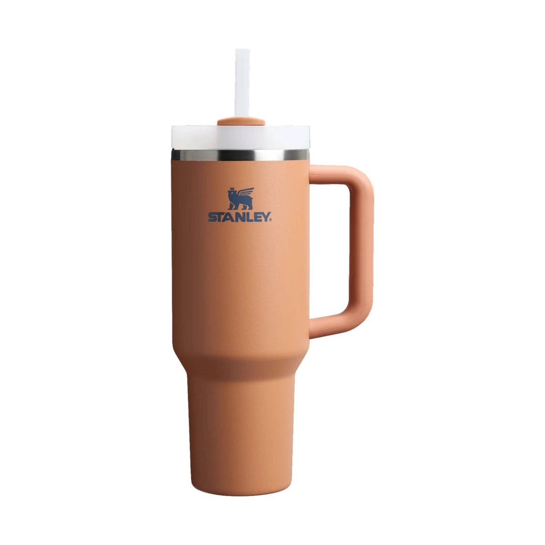 Tan handled insulated tumbler with white lid, clear straw, and blue Stanley logo