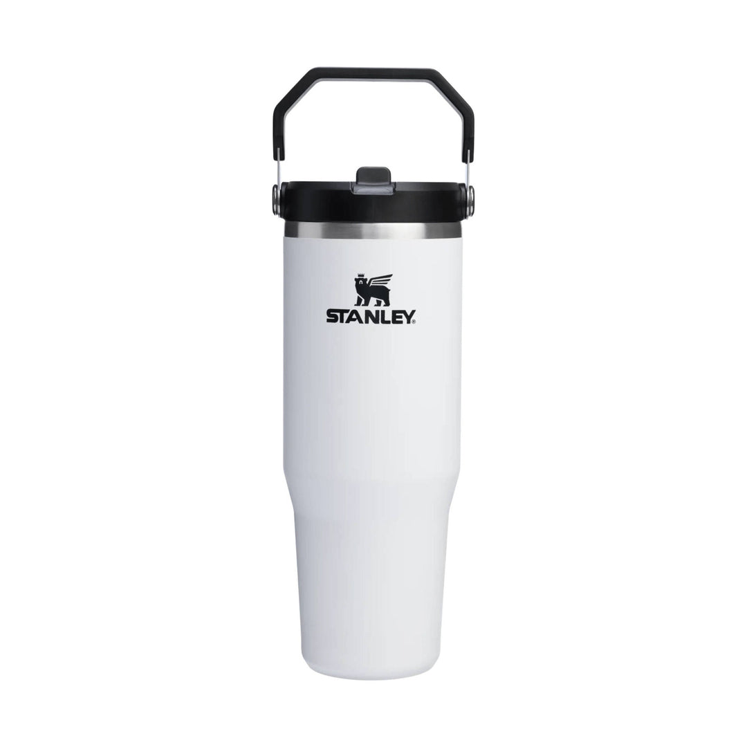 White insulated tumbler with black lid and handle, showing the STANLEY logo