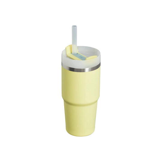 Pale yellow insulated tumbler with a clear lid and straw