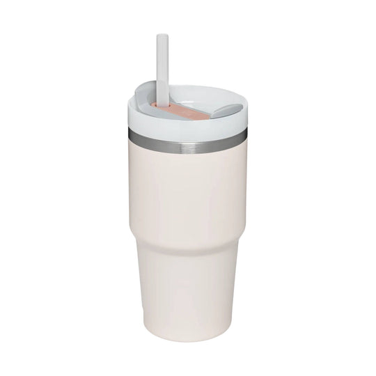 Insulated travel tumbler with lid and straw in a light blush finish