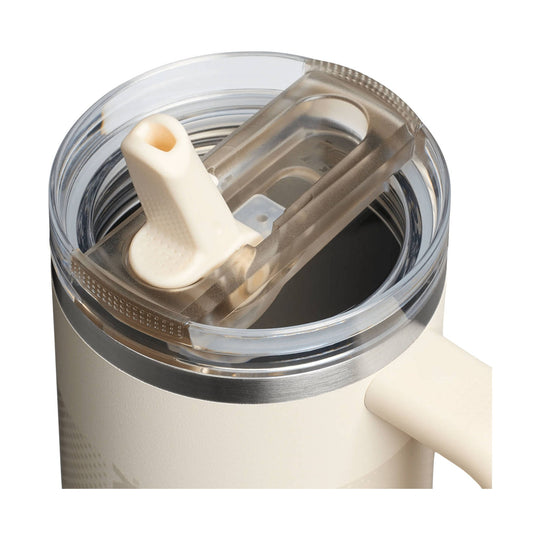 Cream insulated tumbler lid with clear flip straw opening and handle