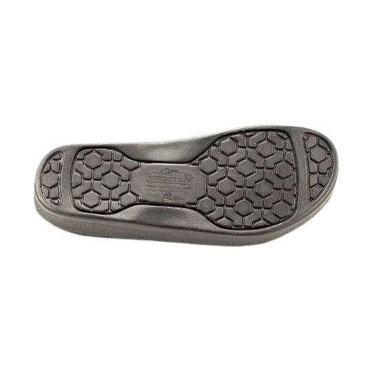 Black clog outsole with hexagonal tread pattern and embossed center branding