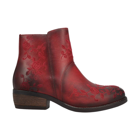 Red ankle boot with floral embossed pattern and low stacked heel, side view