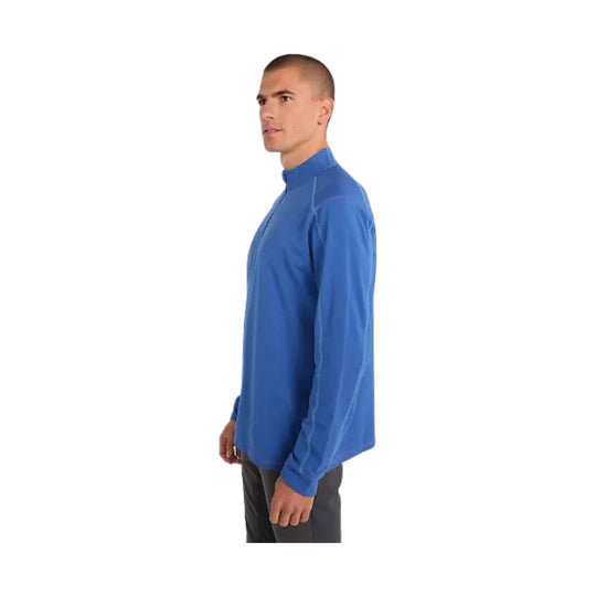Blue long-sleeve quarter-zip pullover shown in side profile on a white background