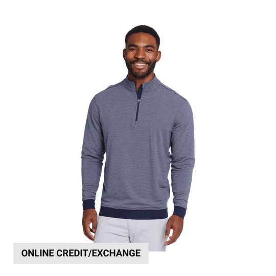 Navy and white striped quarter-zip pullover worn with light pants