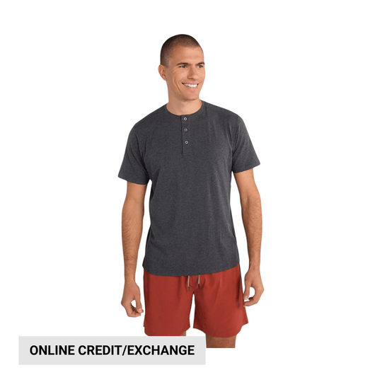 Dark gray short-sleeve henley shirt on a model with red shorts