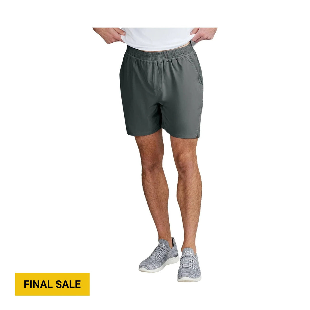 Dark gray athletic shorts with built-in liner, shown on a model with a yellow FINAL SALE label