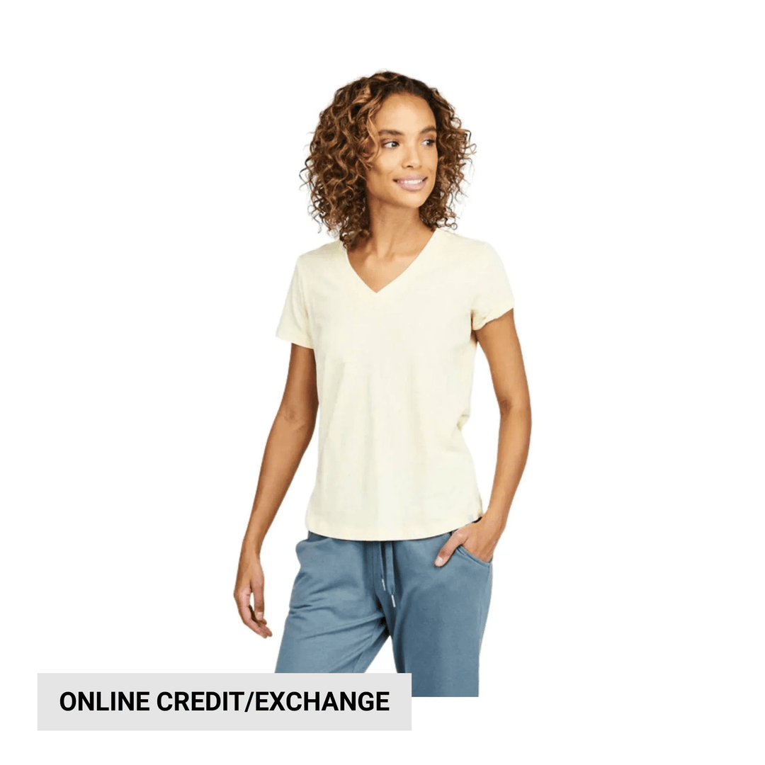 Light yellow V-neck short-sleeve T-shirt with blue pants, shown on a model