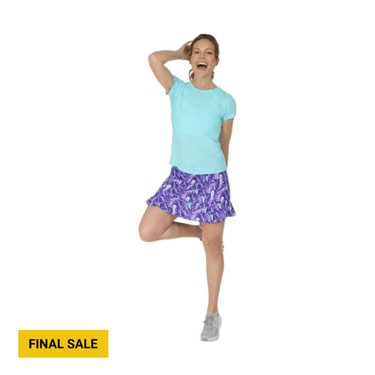 Model wearing a purple patterned skirt with a turquoise T-shirt and gray sneakers; FINAL SALE text.