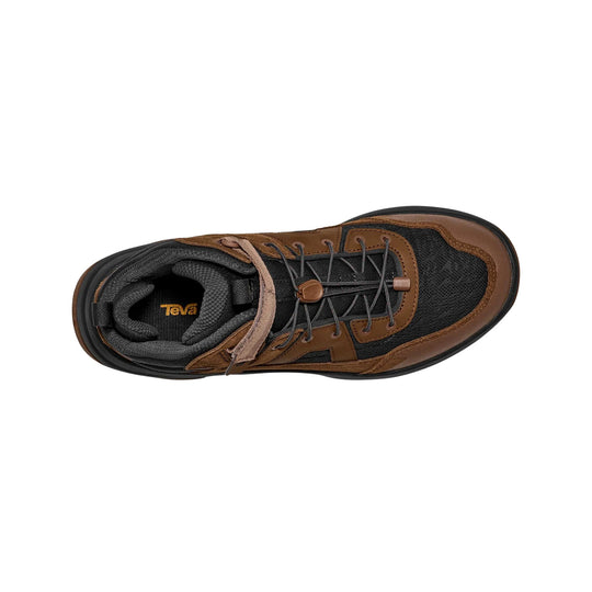 Brown and black mid-height hiking boot with bungee laces and a visible Teva logo on the insole