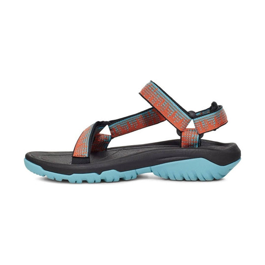 Black and light blue hiking sandal with orange patterned straps and lugged sole