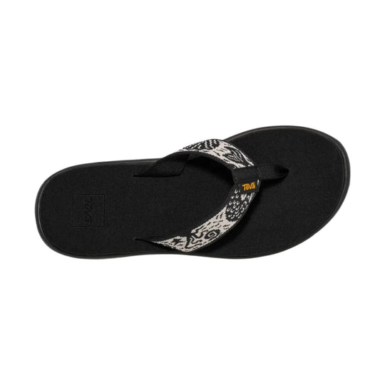 Black thong sandal with a patterned woven strap and Teva tag