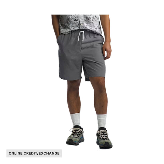 Gray men’s athletic shorts with drawstring waistband on a model, with ONLINE CREDIT/EXCHANGE text