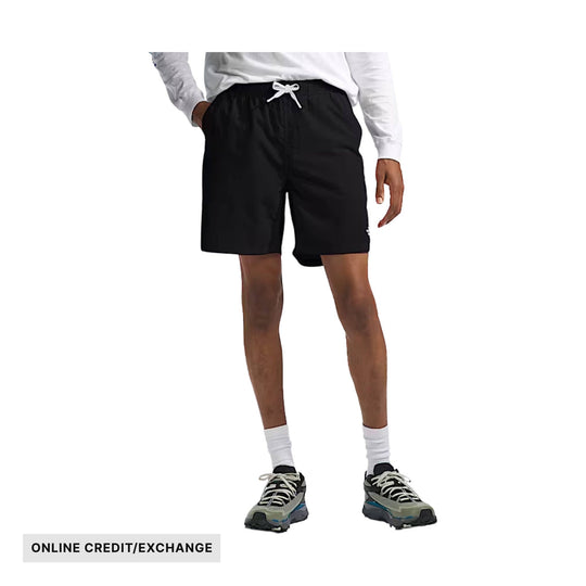 Black athletic shorts with white drawstring on a model, with "ONLINE CREDIT/EXCHANGE" text