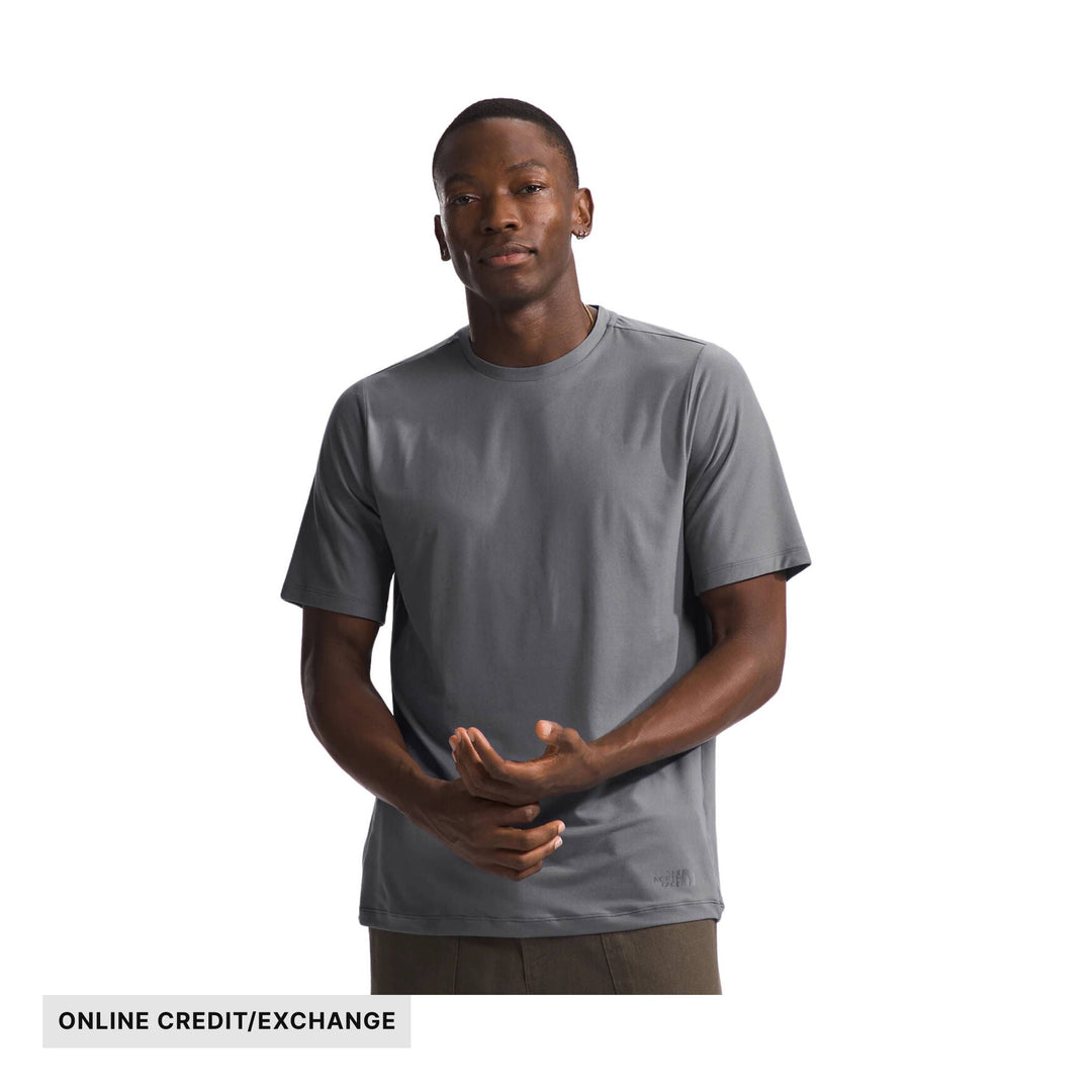 Gray short-sleeve athletic T-shirt on a model with ONLINE CREDIT/EXCHANGE text