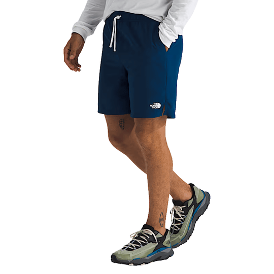 Navy athletic shorts with white drawstring and side logo