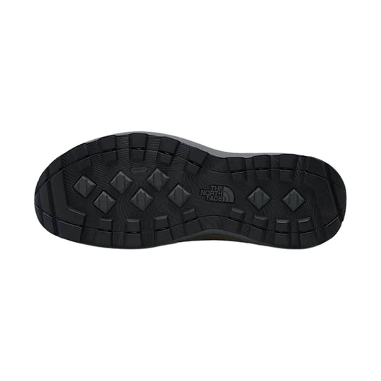 Black boot outsole with deep tread and The North Face logo