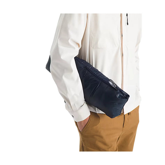 Black crossbody sling bag with a zippered front and THE NORTH FACE logo tag