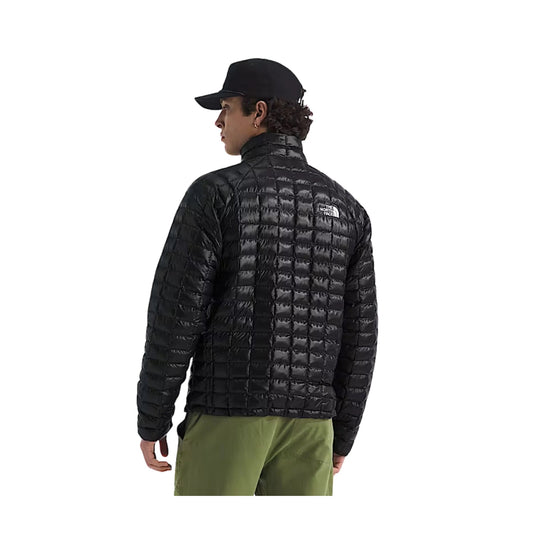 Black quilted puffer jacket shown from the back, with a stand collar and small logo patch on the upper back