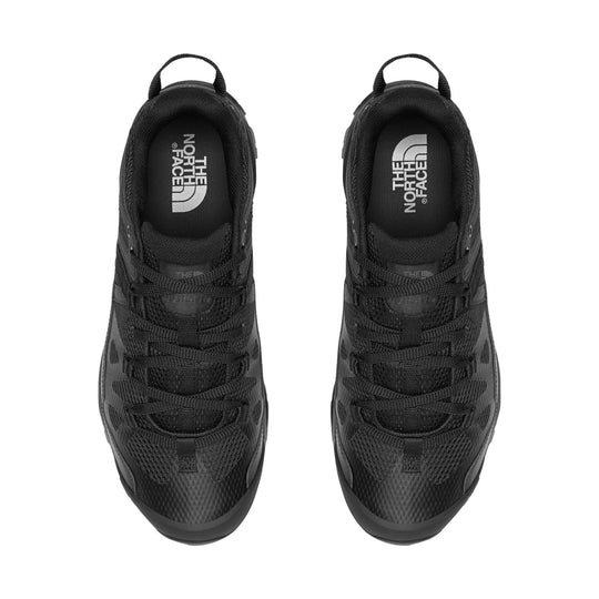 Black trail shoes shown from above with laced uppers and pull tabs