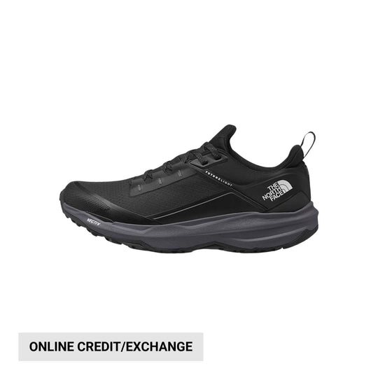 Black low-top trail shoe with gray midsole and visible pull tab