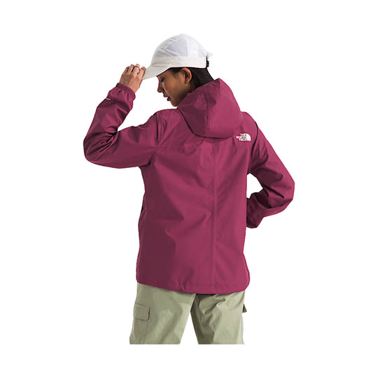 Magenta hooded rain jacket shown from the back, worn with a white cap and light cargo pants