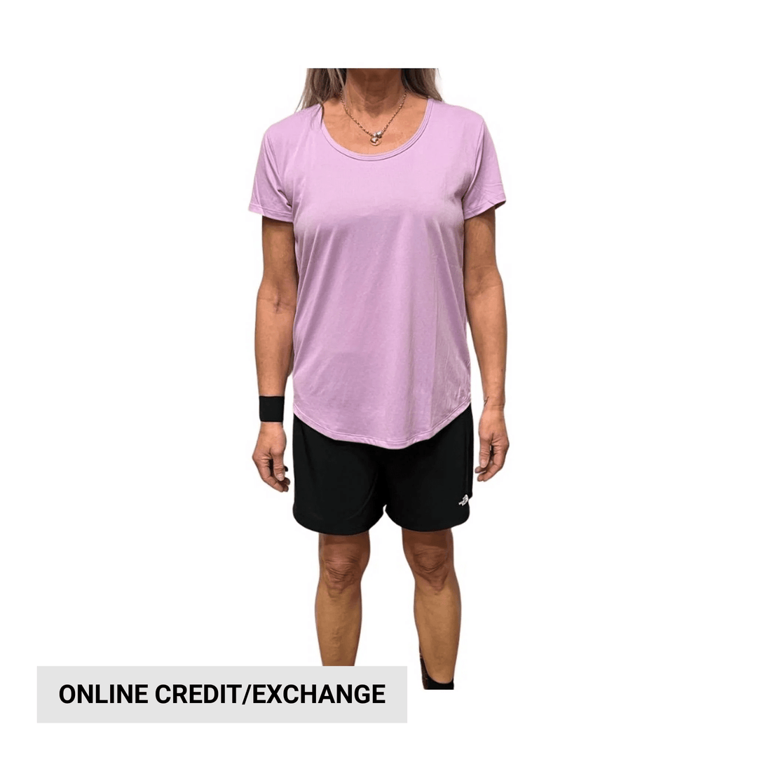 Lavender short-sleeve scoop-neck shirt on a model, with black shorts