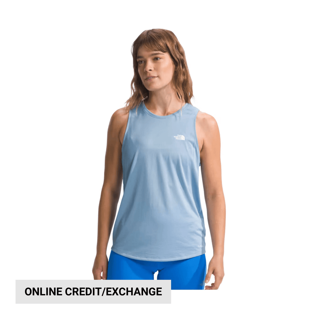 Light blue sleeveless athletic tank top worn with blue leggings